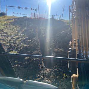 Photos by Spread the Light Homes LLC #4 Trench for underground electrical to commercial buildings.