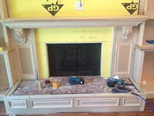 Custom cabinets, new Sheetrock, fireplace mantle