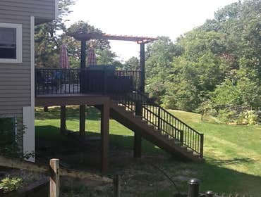 Photos by Custom Home Specialties Inc #2 Timber Tech maintenance free decks with powder coated railings.