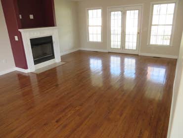 Photo(s) from BDM Construction Carpet removal/ Brazilian Cherry hardwood installation. Painted room. Removed popcorn texture and repainted ceiling.