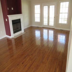 Photo(s) from BDM Construction Carpet removal/ Brazilian Cherry hardwood installation. Painted room. Removed popcorn texture and repainted ceiling.