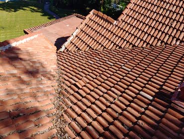 Tile Roof Organic Debris Repair - Northmen Roofing