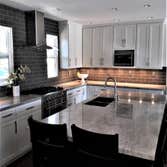 Carlsbad Kitchen Full remodel with 12 foot Island completed with granite counter tops.
New hard wood flooring to match.