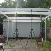 HARRIS Two Car Carport This a 20' X 20' Freestanding carport with 6 -3 x 3 14 gauge Posts set in ground with 24" concrete footings ! 20' Heavy gauge al