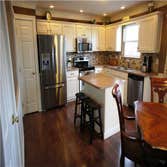 Delaware, Ohio Kitchen Remodel Added trim and bead board to existing oak kitchen cabinets then painted and distressed. Added tile back splash, instal