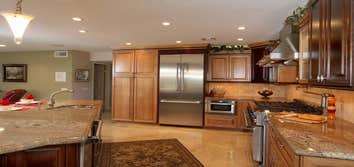 Cypress Kitchen Remodel This project required removing a load bearing and shear wall. The outcome was magnificent. The before pictures are included.