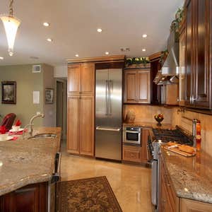 Cypress Kitchen Remodel This project required removing a load bearing and shear wall. The outcome was magnificent. The before pictures are included.