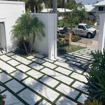 Photos by Woodpeckers Solutions Llc #1 Remove and replace main door and garage doors, Remove existing driveway and replace with concrete steps, covered