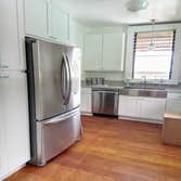 Kitchen renovation: new cabinets, countertop, sink, appliances, refinished floor