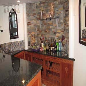 Easton Basement finishing basement, adding customized bar and bathroom.