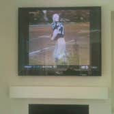 60 inch TV over fireplace