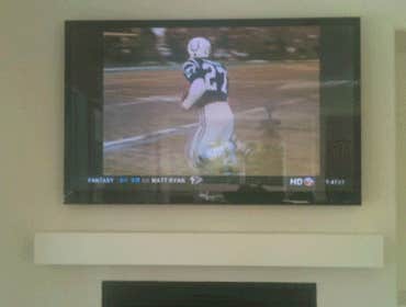 60 inch TV over fireplace