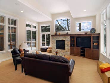 Lockridge Residence This new Transitional Custom Home was built on the owners heavily wooded lot and designed to maintain the woodsy feel while taking 