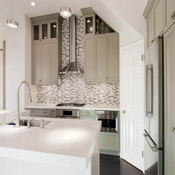Photos by Visionary Home Remodeling #1 Gray & White Kitchen
Open concept kitchen with two colors cabinet provide a contemporary kitchen.
white quartz c