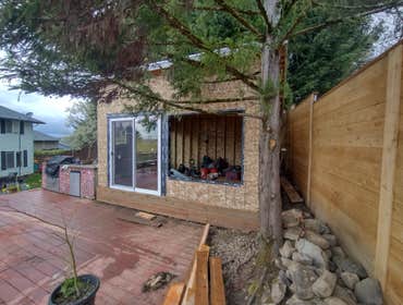 Photos by Stewart & Son Gate & Fence LLC #1 Tiny House with pergola. Small house 17' by 12' small bathroom with pocket door, and small sink with water 