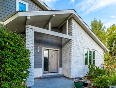 James Hardie Siding - Aged Pewter w/Cobblestone Trim + Cultured Stone Masonry