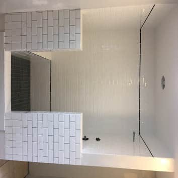 Walk in showers fully tiled