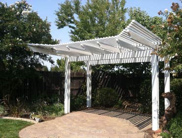 Duralum Patio Cover DURALUM performs like real wood can't and
unlike real wood, DURALUM shade structures
will not burn, attract termites, crack, peel