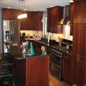 Project photos from Shaun P Hamilton Kitchen remodle in cherry, With Bilevel island. 20 X 30 Composite deck project complete. Interior trim project...
