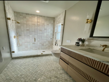 Full gut and replace with me new floor to ceiling tile and new shower & marble vanity