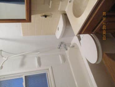 Bathroom remodel Removed tub ,wall tile, shower door, flooring, plaster wall and ceiling. Installed new tub, toilet, drywall, fan light, tub surround, 