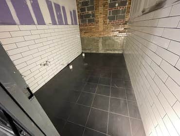 Commercial Tile Work by Alzaria Construction LLC We provide the tile for a total of 7 bathrooms, one of which we tiled in a shower.