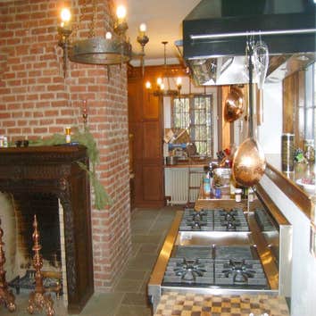 Antique Lighting Mix of cast iron ceiling fixtures, wall sconces and hidden low voltage xenon lighting provide highly controllable task and mood lighti