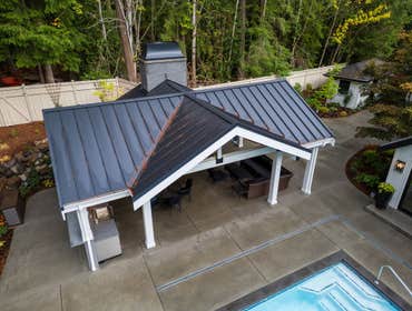 DE RECAT PROJECT Outdoor pavilion. 30x15. 4 Hip metal roof pavilion. Retaining wall that has bbq area and fireplace. Wood structure. Pool