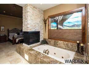 Photos by Sequoia Homes LLC #1 This Tuscan/Mediterranean style home is truly one of Mohave County's finest luxury homes. Over 1 acre of property in the