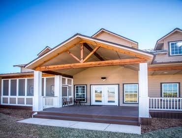 Ranch Road Ranch Road is a design that originated on an open rural site. Located west of Calumet, Oklahoma the site is situated next to a lake with a s