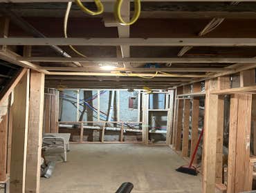 Photos by Your Expendable Services LLC #1 Basement remodeling project completed with new framework, walls placed and painted. New recess lights and LPV
