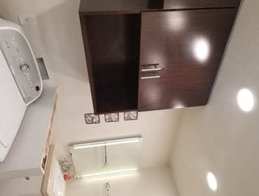 V. Jones Bathroom/Laundry Room Remodel - Tub to Step-in Shower Conversion with Linear Drain
- New Vanity, Toilet, Sink, mirror, toiletries
- All new fl