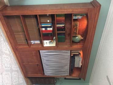 Stained shelving w/ adjustable shelves and recessed lighting