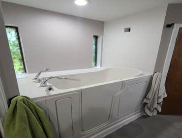 Photos by Cormelia Group LLC #5 Flood damage granted an opportunity for client to do total remodel for bathroom. Walk in tub and custom shower with Blu
