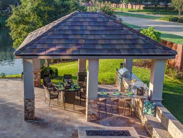 The Shapiro The cabana provides ample cooking and dining space to host gatherings for friends and family. The materials were selected to tie in as a na