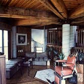 Pereira Residence Built using local tide water red Cyprus sinker logs for structure, the roof cupola allows the home to breathe as if a pair of lungs, 