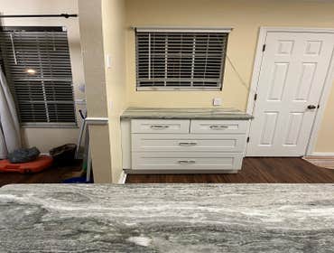 Photos by Tropical Building & Remodeling Inc #1 Completely removed old kitchen and end pony wall. Cut down pony wall to cabinet height and installed ro