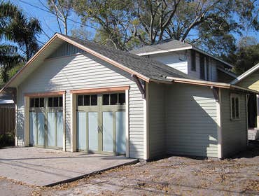 Detached Bungalow Garage Custom 22'x20' garage with a 6'x12' workshop. Garage has cypress siding, craftsman bungalow details, wood casement windows and