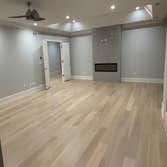 Photos by General Hardwood Flooring Inc #1 White oak 5”x3/4 installed, sanded and refinished with custom stain color