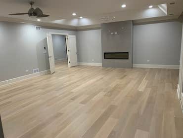 Photos by General Hardwood Flooring Inc #1 White oak 5”x3/4 installed, sanded and refinished with custom stain color
