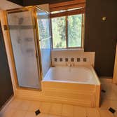 Park City Residential Bathroom Remodel Transforming this primary bathroom involved a complete renovation, featuring sleek new tile flooring, modern sho