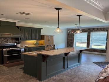 Remodeled Kitchen with New Paint, Cabinets, Granite Countertops, and Fixtures