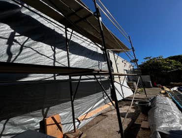 Photos by Santiago's Bay Builders Inc #1 Remodeling half of the building