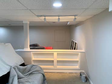 knee wall with bookcase knee wall built with 4 bookshelves to load bearing column in basement