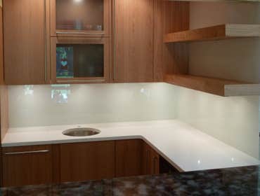 BCV Design kitchen project & other glass projects Round glass table on copper base, glass counter supported by stainless steel brackets and colored gla