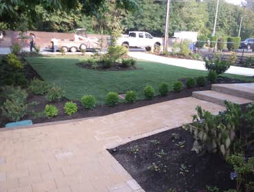 Photos by Rc Healthy Lawns #1 Full yard restoration pavers, retaining walls, vegetable gardens, flower beds, sod, shrugs ,plants and trees.
