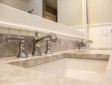 Baine Contracting Inc Project Multiple jobsites - showing kitchens, interior and exterior trim work, new homes, bathrooms, tile work, wood and iron ra