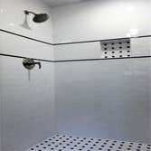 Photos by Cornerstone & Son Construction LLC #1 Shower stall remodeled with subway tile, black & white mosaic tile, black accents and recessed shampoo 