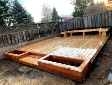 16' x 16' cedar deck, with bench, steps and planters.