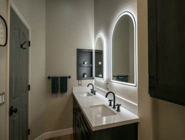 Modern Bathroom Remodel with LED Mirrors This bathroom remodel strikes the perfect balance between luxury and modern simplicity. The design features il